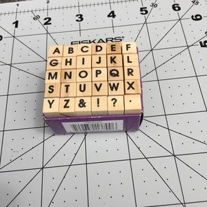 Alphabet stamps rubber mounted on wood